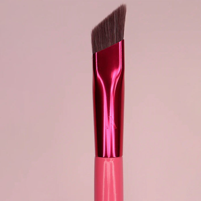 Cosmo angled eyebrow brush for concealer with pink handle and dense brown bristles