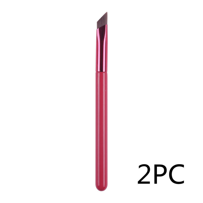 Cosmo angled eyebrow brush for concealer with a sleek pink handle, angled bristles for precise application