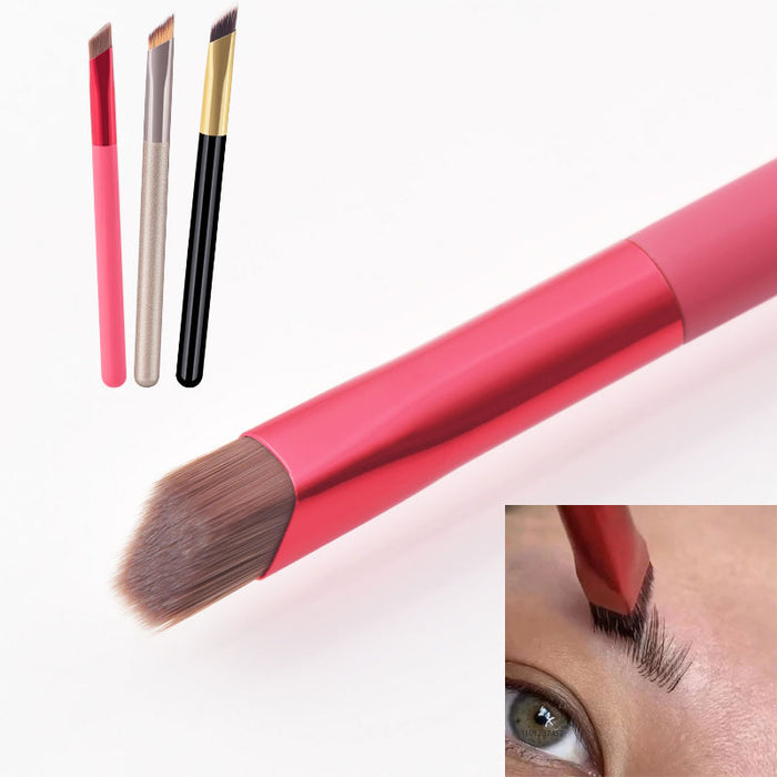 Angled eyebrow brush for concealer with soft bristles and different handle colors for precise makeup application