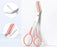 Cosmo eyebrow trimming knife with pink handles and built-in comb for precise eyebrow grooming