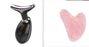 Black EMS wrinkle remover device with LED display and pink heart-shaped facial massage tool