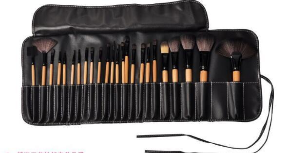 Cosmo professional makeup brush set with multiple brushes and wooden handles in a black roll-up case