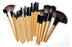 Cosmo professional makeup brush set with various wooden handle brushes for detailed and full-face application
